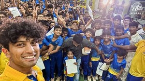 Rachin Ravindra takes a selfie with kids at the Super Kings Academy